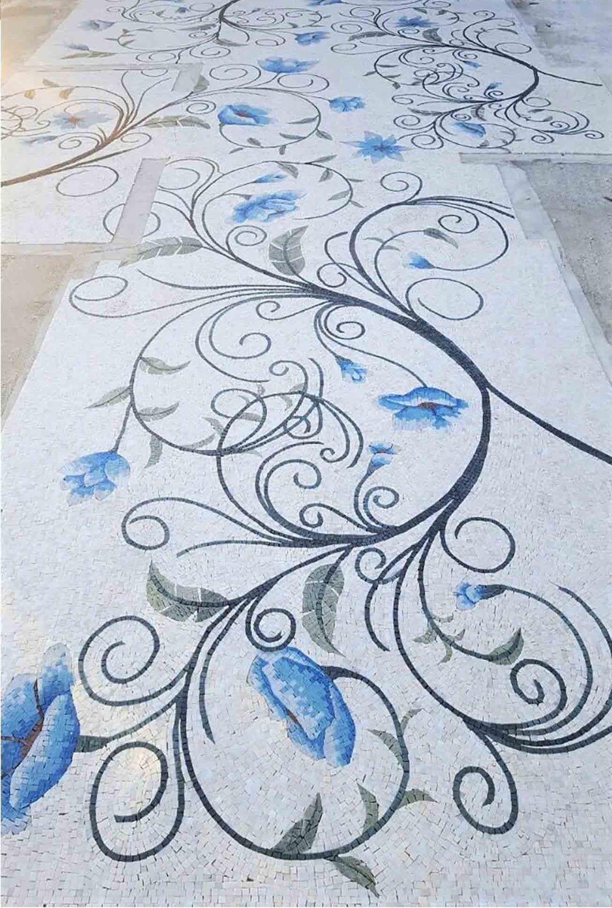 Decorative floor with floral patterns and blue flowers on a light background