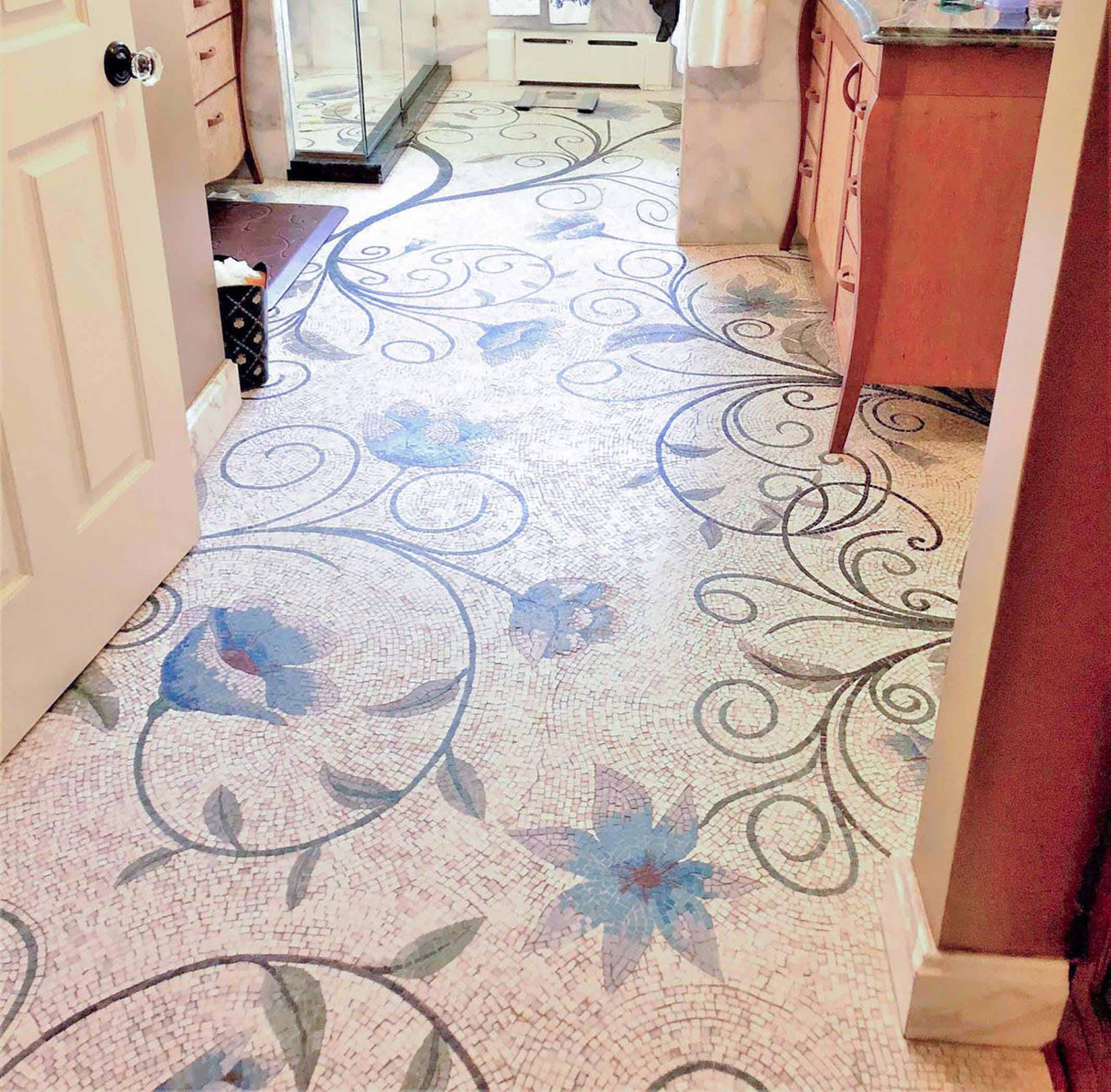 Bespoke luxury bathroom mosaic floor with custom handcrafted Mediterranean azure floral vine marble mosaic flooring design.