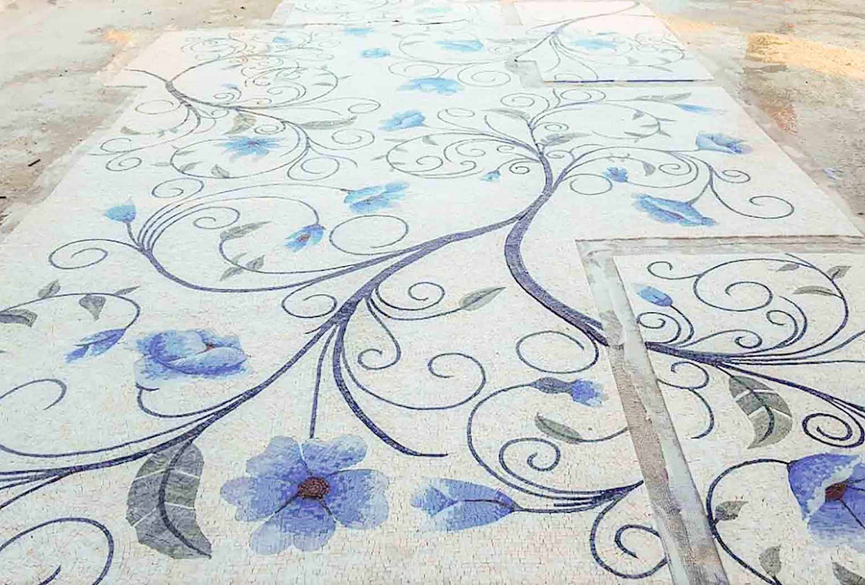 Decorative tiles with floral patterns on a floor