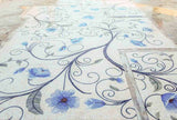 Decorative tiles with floral patterns on a floor