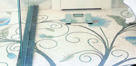 Bespoke luxury bathroom floor with custom handcrafted Mediterranean azure floral vine marble mosaic flooring design.