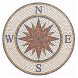 Handcrafted round marble mosaic medallion featuring a classical 16-point compass star with cardinal N S E W letters in terracotta red, slate grey, ochre, and cream stone.